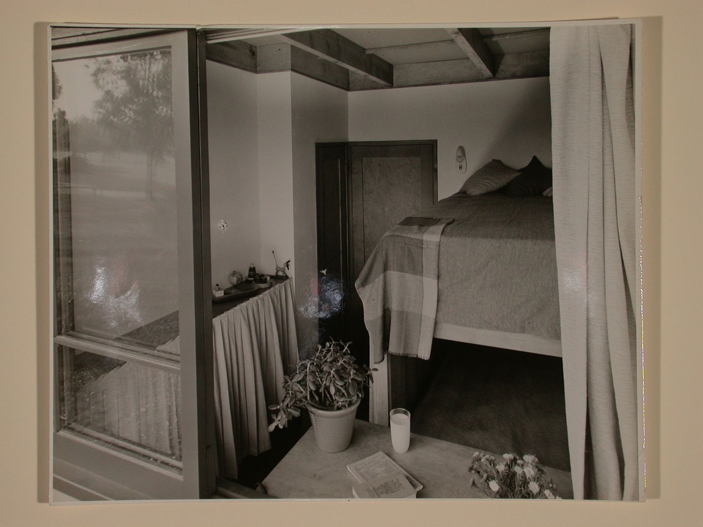Exterior view into a furnished upstairs bedroom