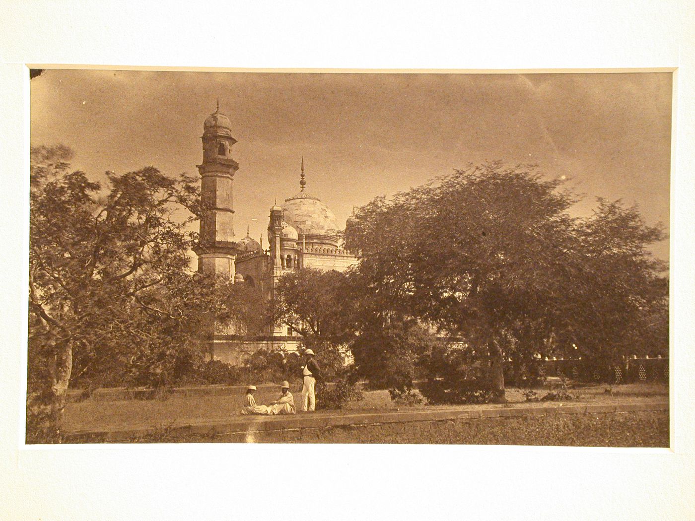 Partial view of the Bibi-ka Maqbara (also known as the tomb of Rabia Daurani) with trees and people in the foreground, Aurangabad, India