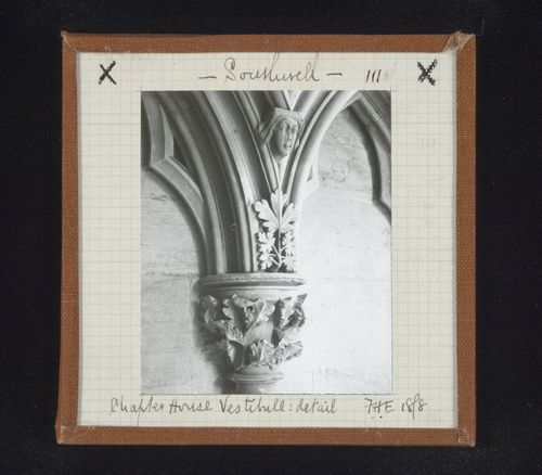 Detail view of blind arcade with capital and sculpture of head in vestibule of Chapter House, Southwell Minster, Southwell, Nottinghamshire, England