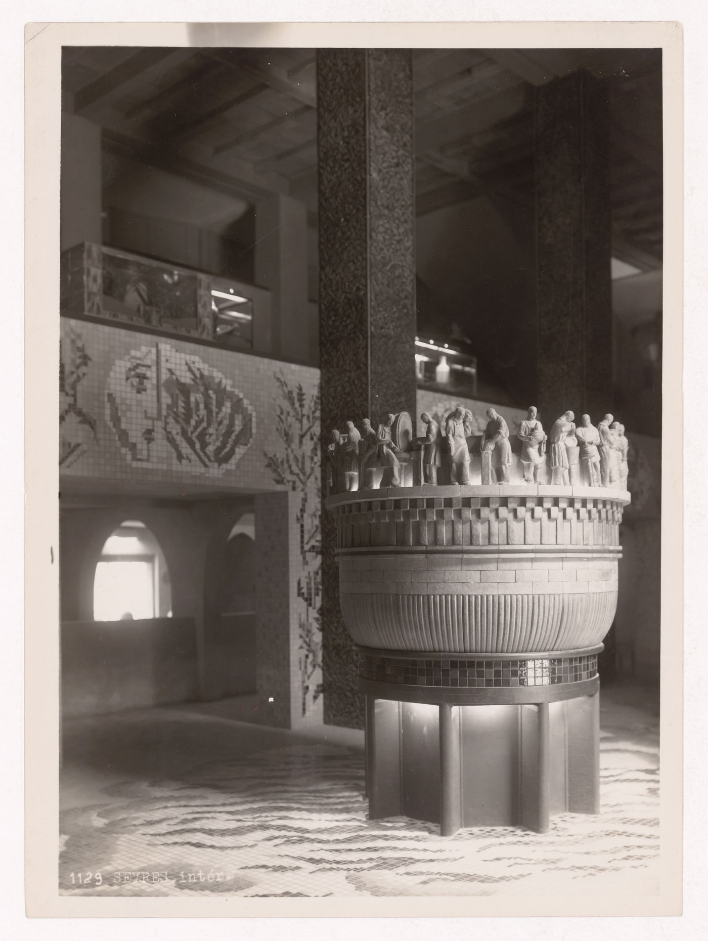 Interior view of the Pavillon de la Céramique, de la Verrerie et de la Monnie showing a mosaic and font, 1937 Exposition internationale, Paris, France