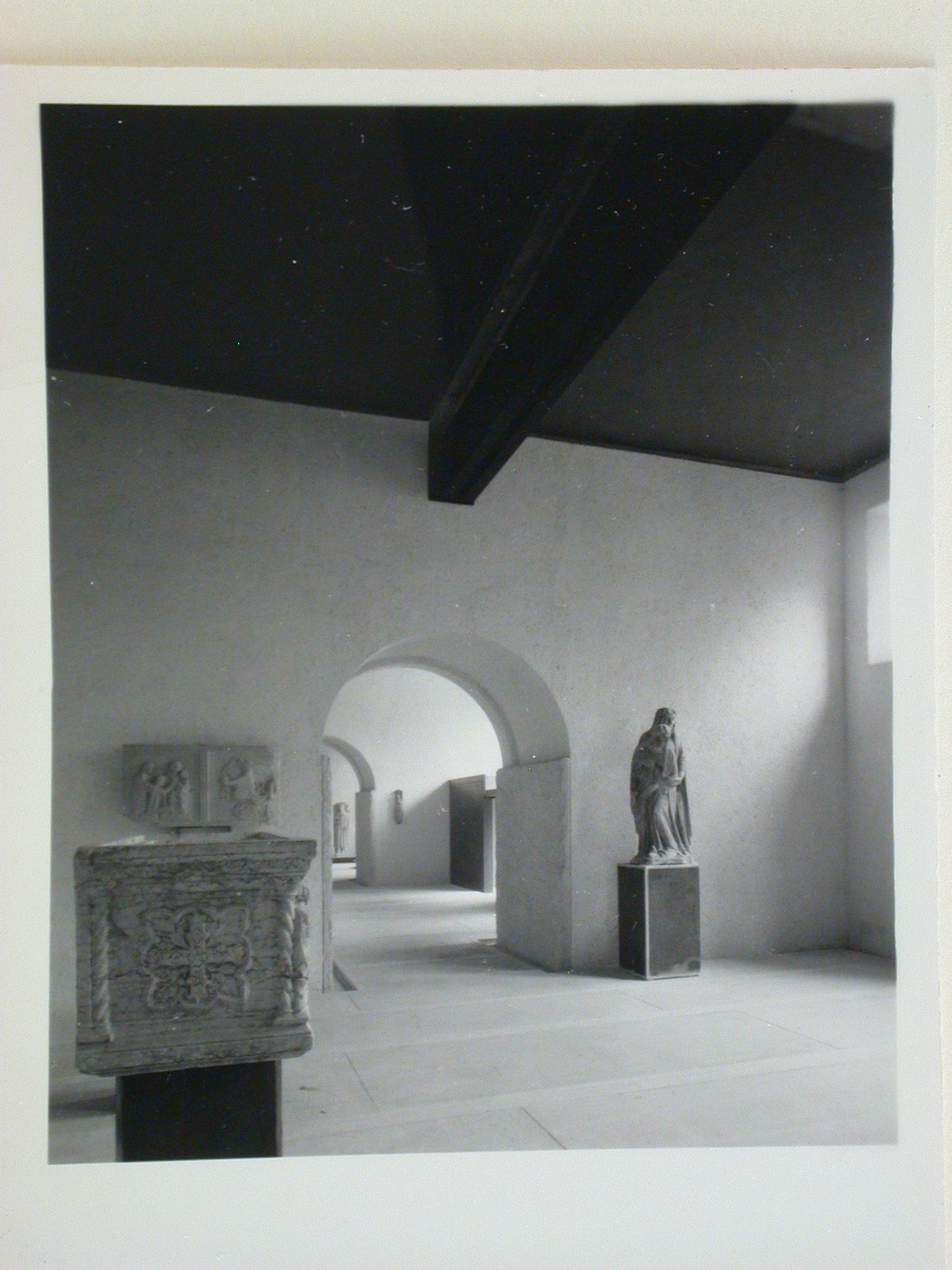 Interior view of a gallery showing a statue and reliefs, Museo di Castelvecchio, Verona, Italy
