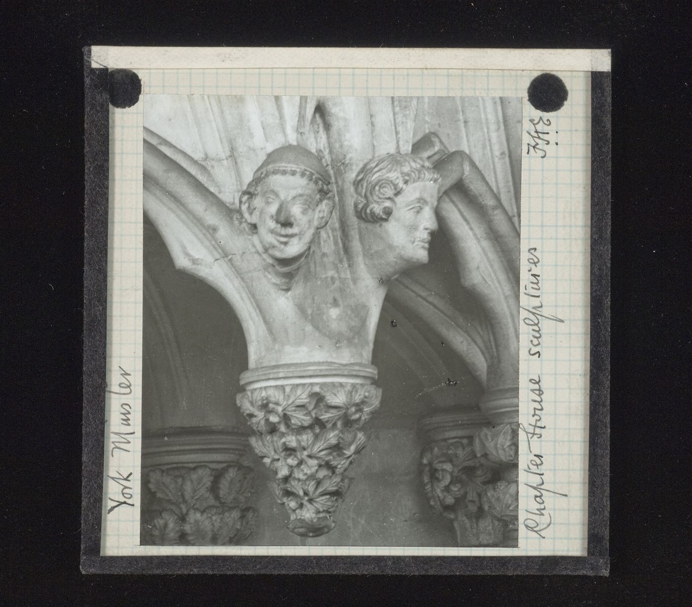 View of two sculptures of heads and pendant of canopy of Chapter House, York Minster, York, North Yorkshire, England