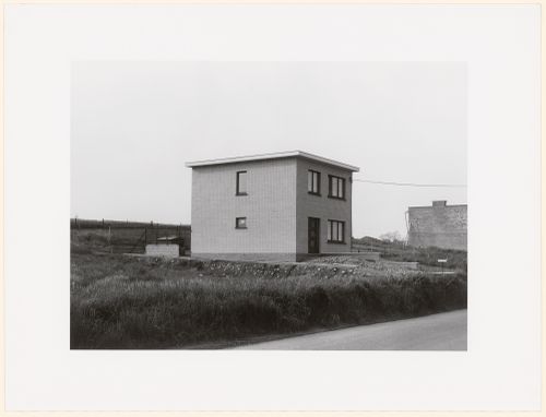 View of a newly constructed cube shaped brick house
