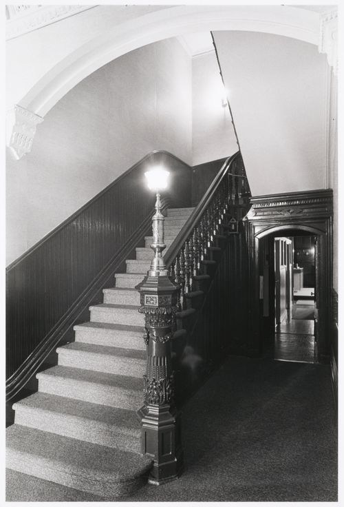 Interior view of the original carved wooden stairs in the east part of Shaughnessy House, Montréal, Québec