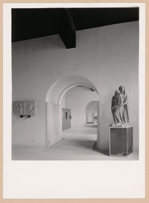 Interior view of a gallery showing doorways, a statue and reliefs, Museo di Castelvecchio, Verona, Italy