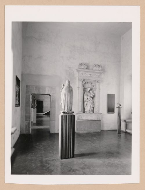 Interior view of the Sala dei Gagini showing sculptures with the Sala della scultura in the left background, Palazzo Abatellis, Galleria regionale della Sicilia, Palermo, Italy