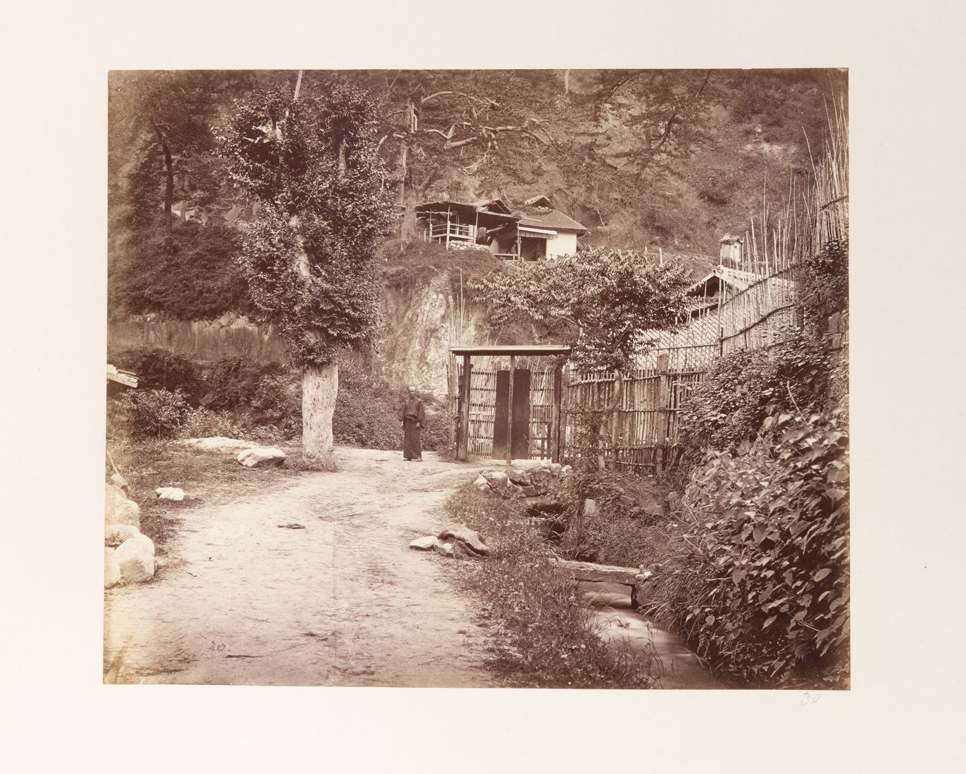 View of houses, a road, and a man, near Kobe, Japan
