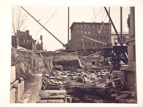 Treasury Building under contruction: View of ground level pit with cranes on platforms, Washington, District of Columbia
