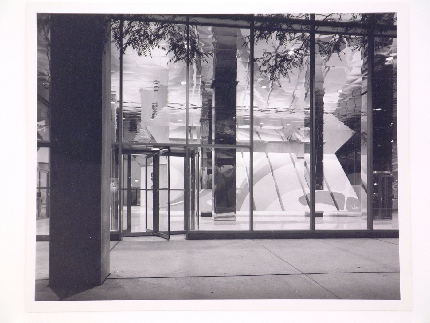Interior view of the lobby of the 200 West Monroe Building at night from the arcade, Chicago, Illinois, United States