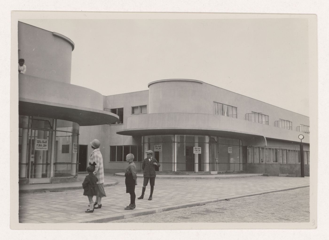 Exterior view of industrial row houses showing corner stores, Hoek van Holland, Netherlands