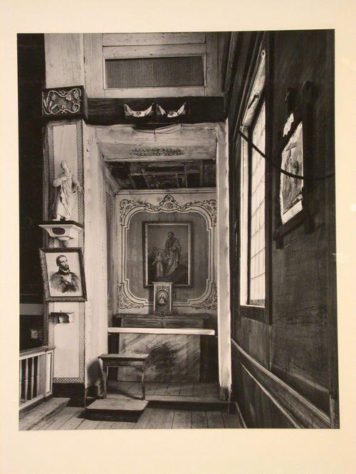 Interior view of the Church of the Sacred Heart showing the right altar, a statue of the St. John carved by Anthony Ravalli and a lithograph of St. Francis Xavier, Cataldo, Idaho