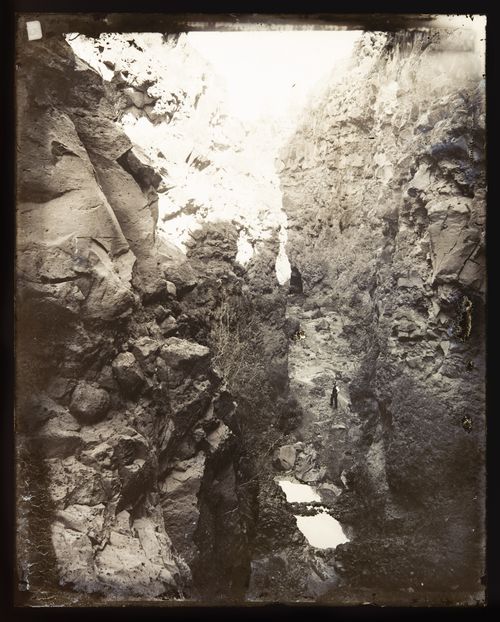 View of man standing in unidentified canyon, California?, United States of America