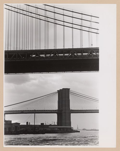Partial views of the Manhattan and Brooklyn bridges with the Statue of Liberty in the background, New York City, New York