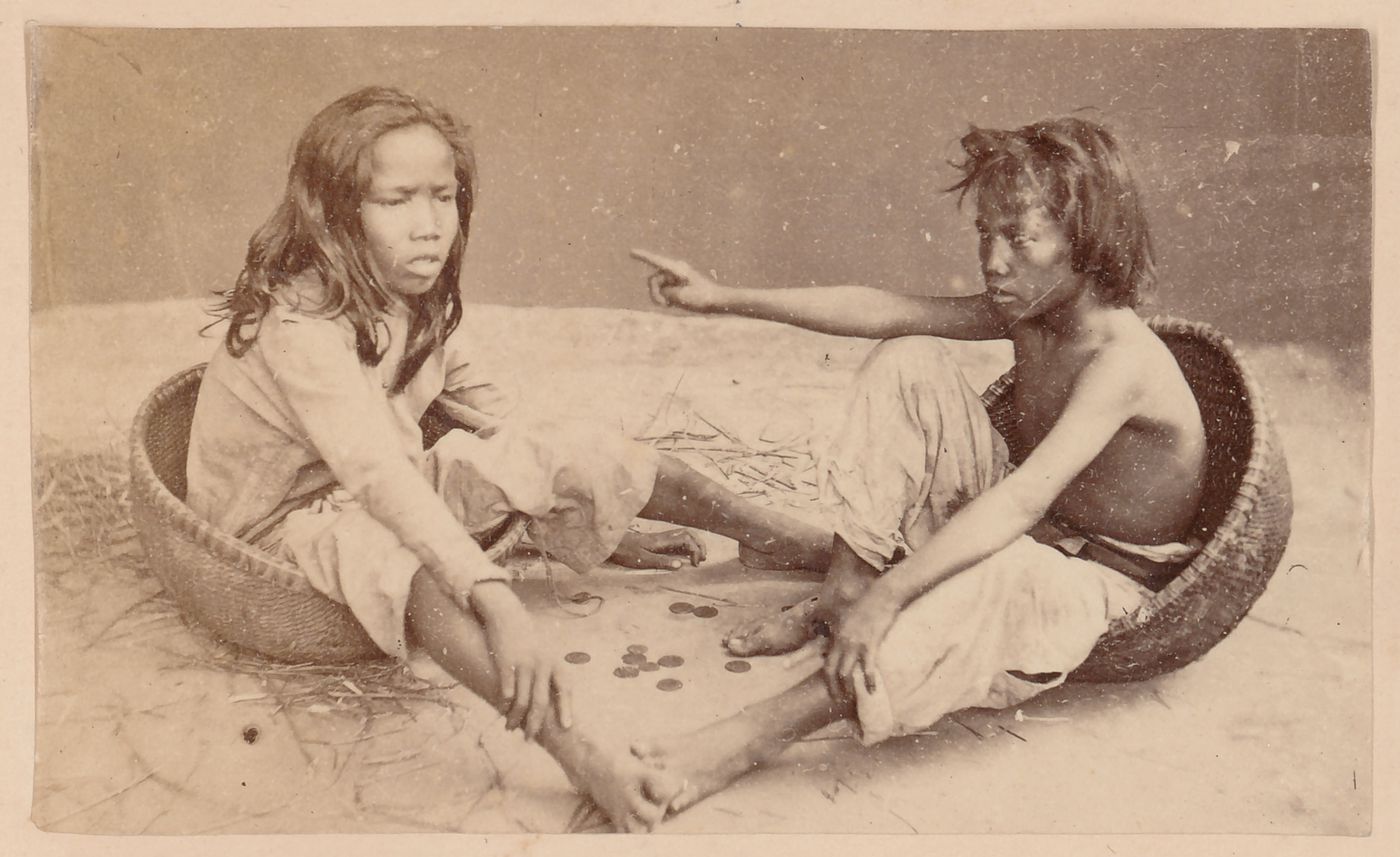 Group portrait of two people, probably in Cochin China (now in Vietnam)