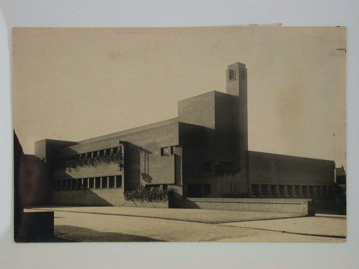 Exterior view of school showing two facades, entrance and tower, Hilversum, Netherlands