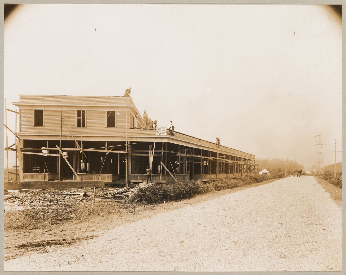 View of a commercial building under construction, corner of Broadway and Kingsway, Coquitlam (now Port Coquitlam), British Columbia