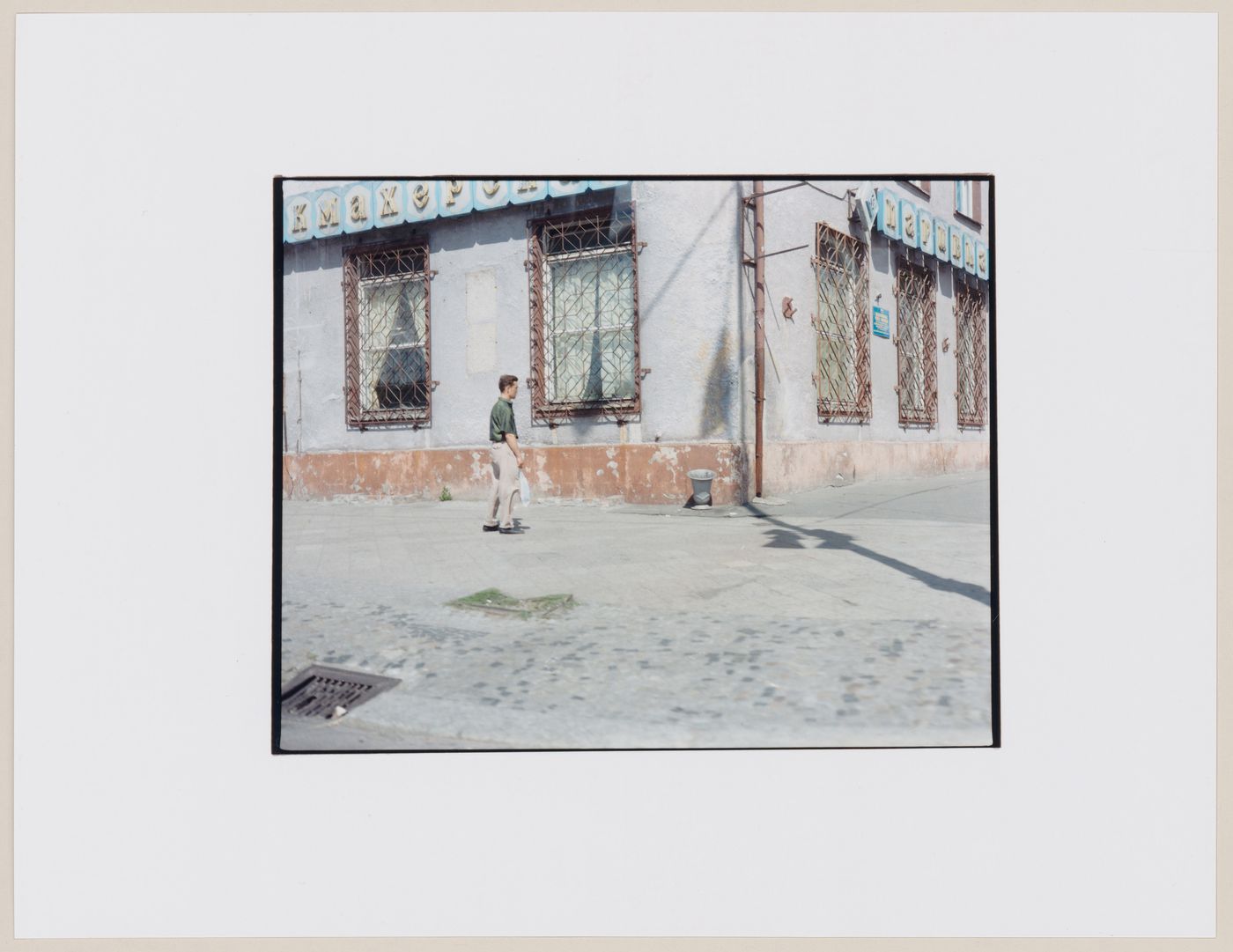 Portrait of a man standing beside a building, Kaliningrad, Kaliningradskaia oblast', Russia (from the series "In between cities")