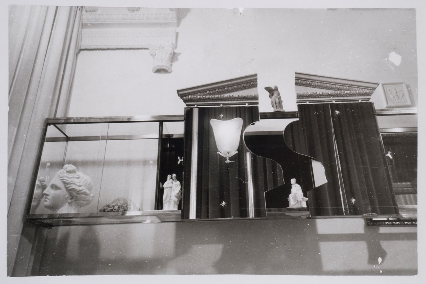 Interior view of Casa Devalle showing the living room with a display cabinet in the form of a temple with an open pediment surrounded by sculptures, Turin, Italy