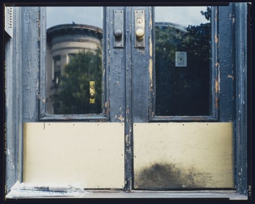 Close-up view of the lower portion of a residential building's double doors, 8th Street, Brooklyn, New York City, New York