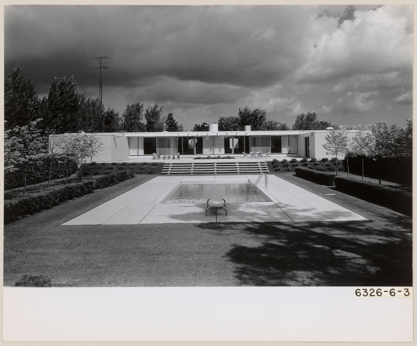 Exterior view of Parkin's residence and swimming pool at 75 The Bridle Path, North York