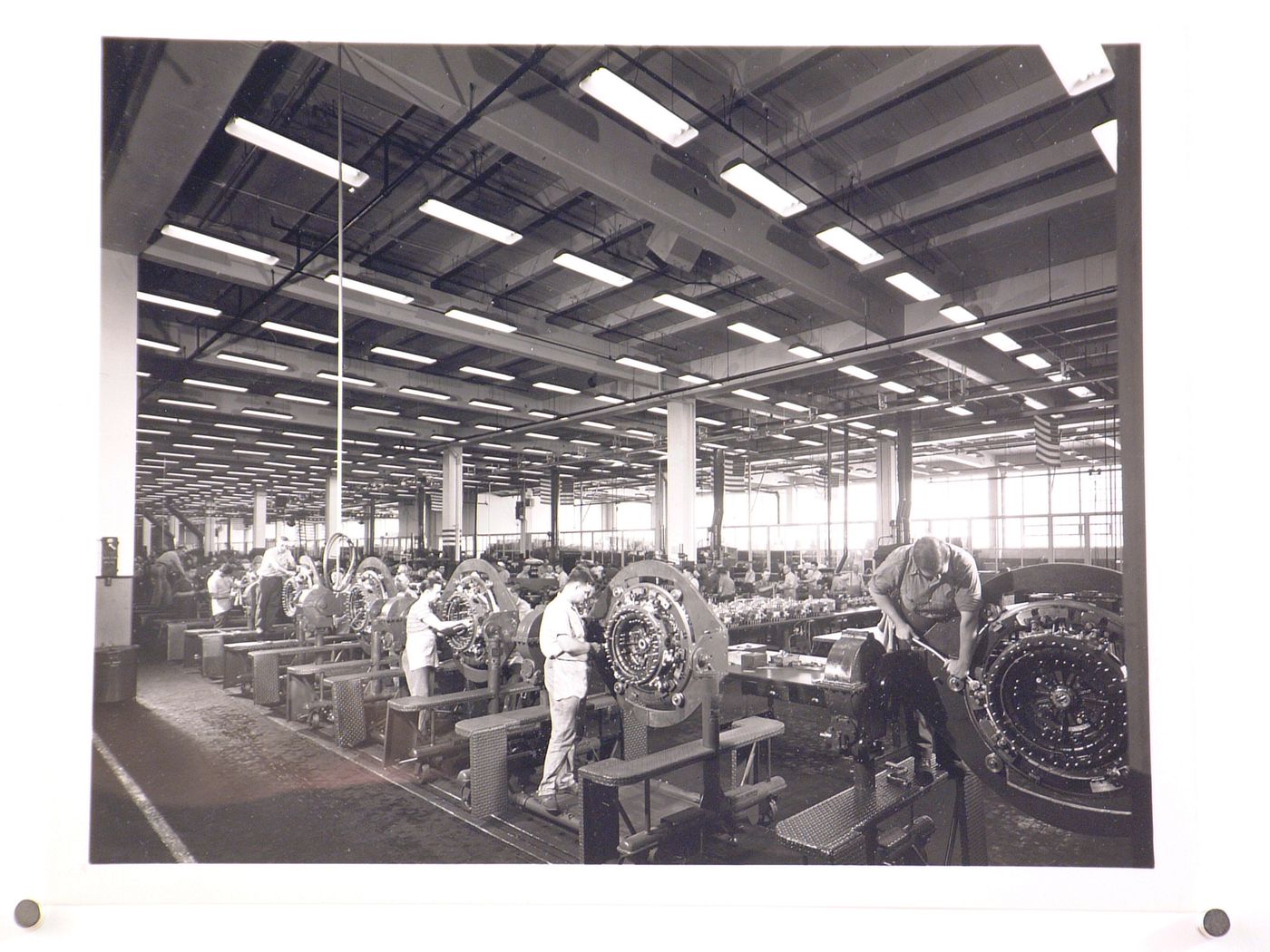Interior view of the Motor Manufacturing Building showing workers assembling motors, Nash-Kelvinator Corporation Assembly Plant, Kenosha, Wisconsin
