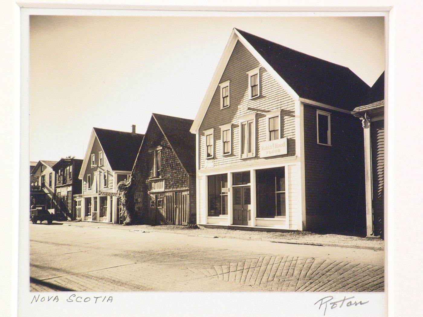 Robin Hood Flour store, frame houses on street, Nova Scotia