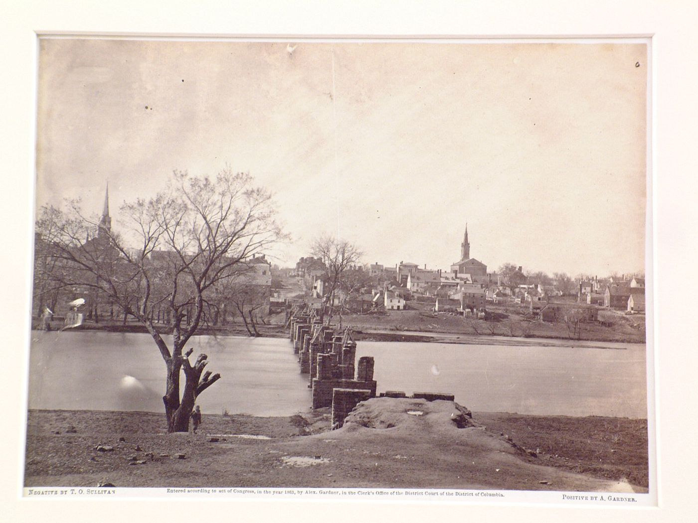View of the ruins of a bridge with the town of Fredericksburg in the background, Virginia, United States