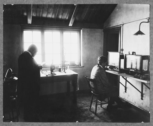 Two men inside a scientific laboratory, Kryn and Lahy Metal Works, Letchworth, England