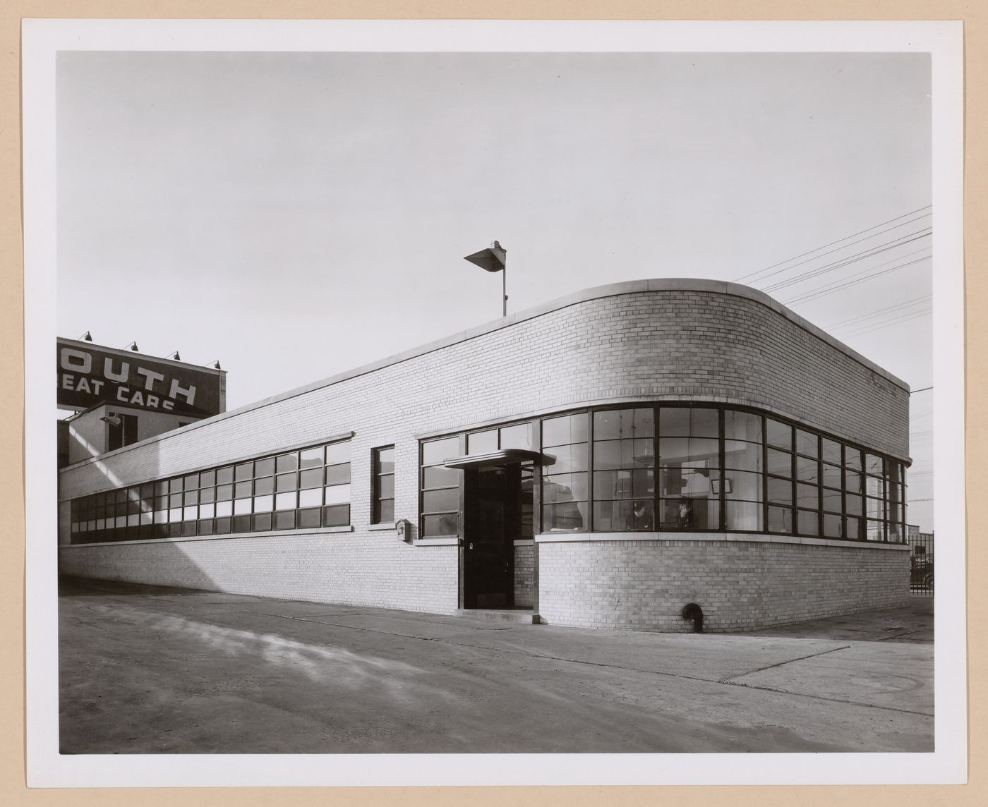 View of the principal and lateral façades of the Hospital, Chrysler Corporation Plymouth division Automobile Assembly Plant, Detroit, Michigan
