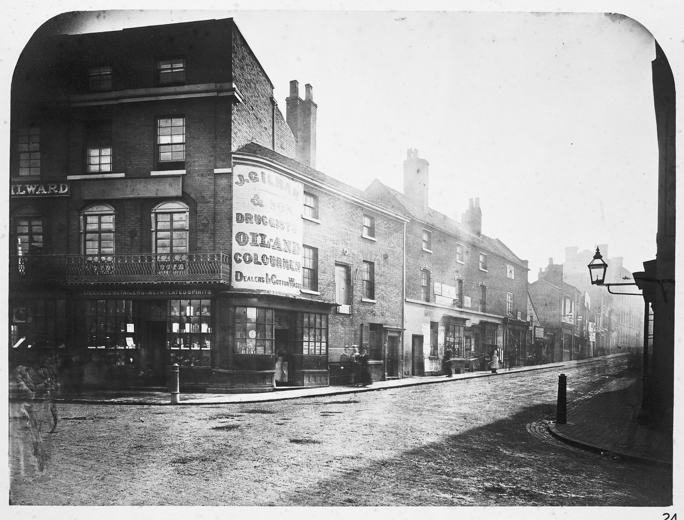 View of Steelhouse Lane, particularly the shop of J. Gilman & Son, Druggists Oil and colarmen dealers in cotton waste, Birmingham, England