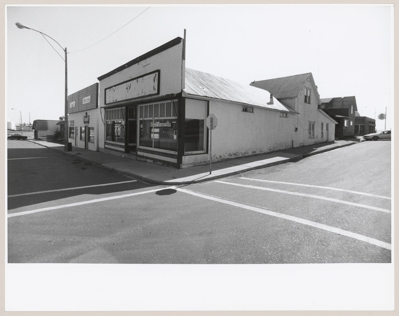 View of the principal and lateral façades of stores and houses, Milk River, Alberta