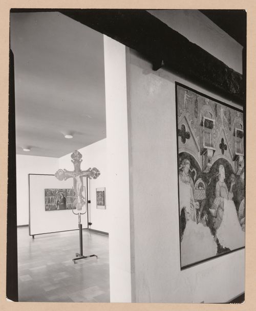Interior view of a galleries showing paintings and a freestanding painted crucifix, Museo Correr, Venice, Italy