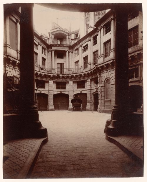 Hôtel de Beauvais: Looking into courtyard from street entrance, showing garage entrances, Paris, France