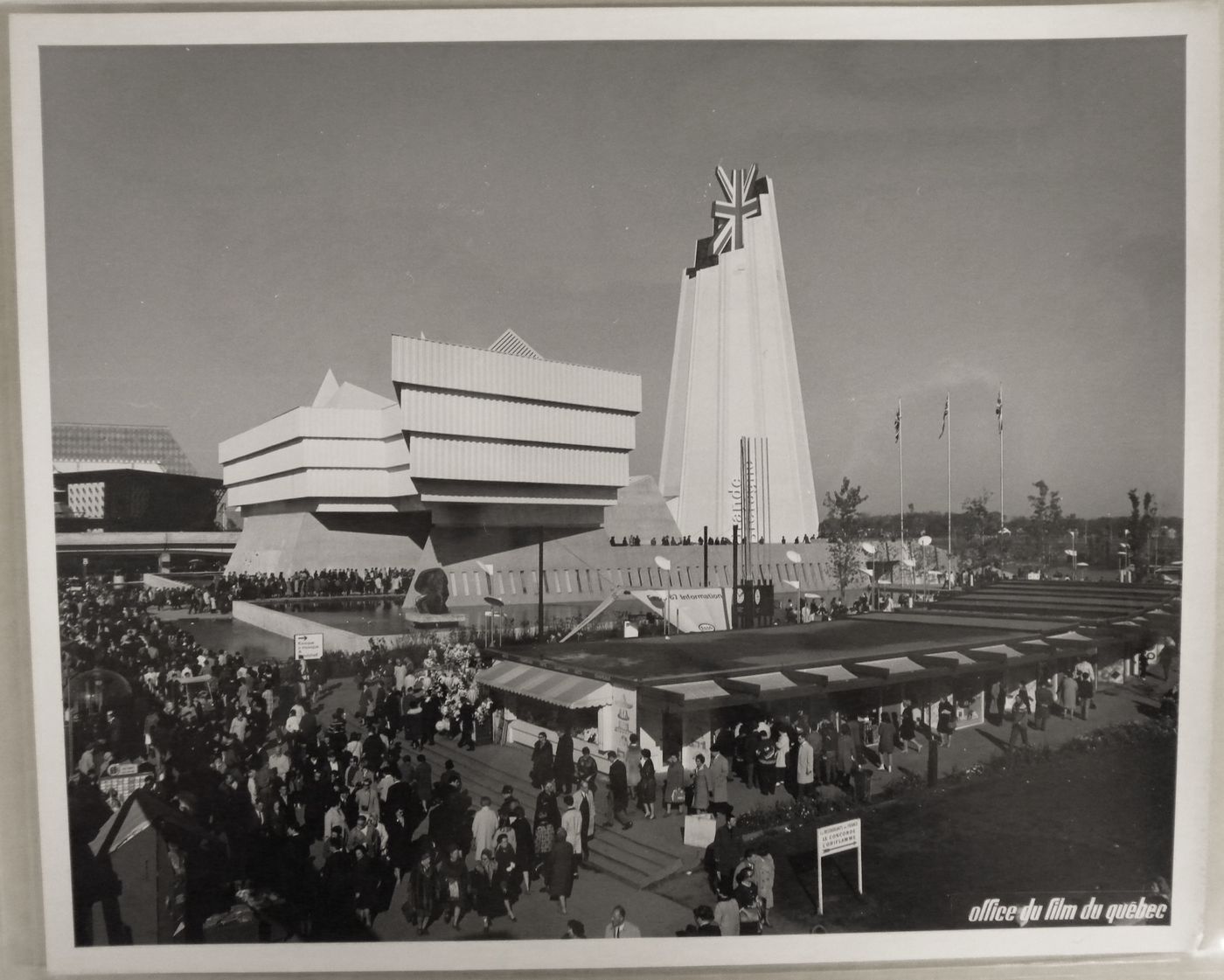 View of the Pavilion of Great Britain with boutiques in foreground, Expo 67, Montréal, Québec