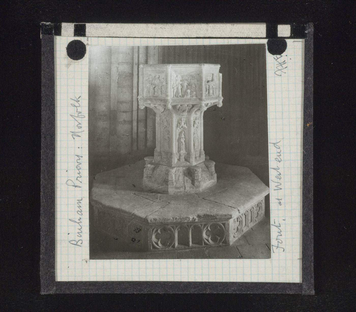 View of baptismal font at the west end of Binham Priory, Norfolk, England