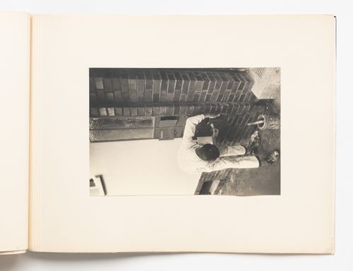 Exterior view of a worker painting mailboxes, Hellerhof Housing Estate, Frankfurt am Main, Germany