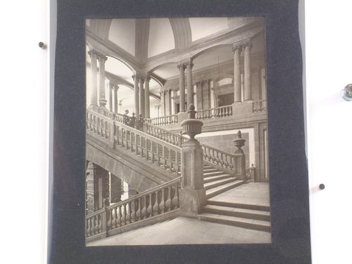 Interior view of the Palacio de Minería showing the principal stairs with three men, Mexico City, Mexico