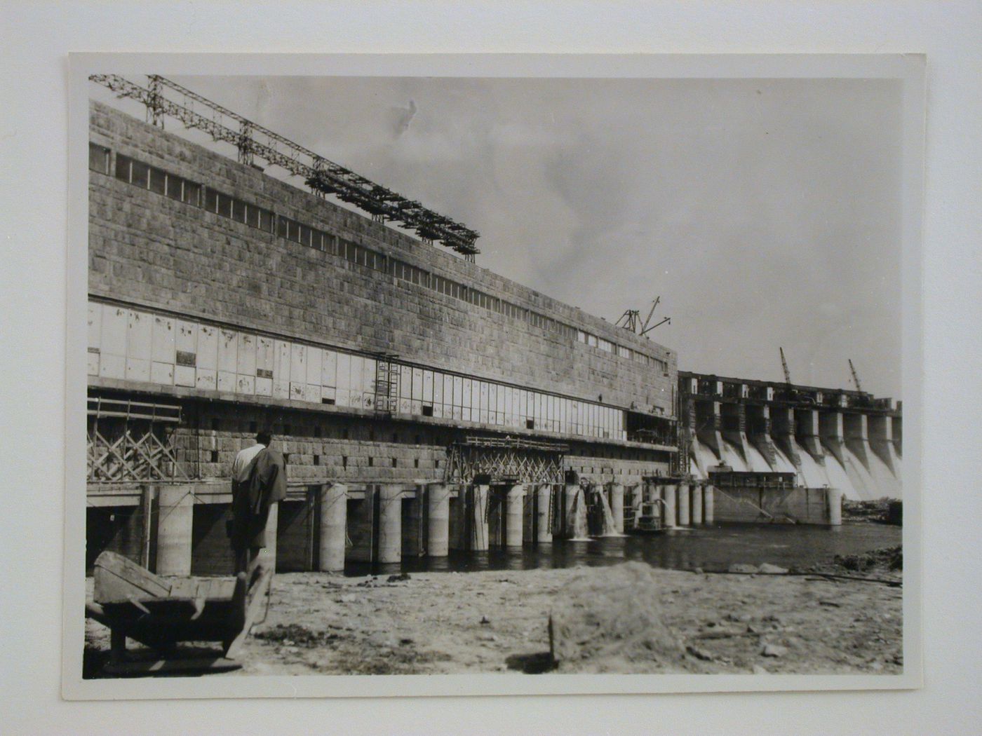 View of Dnieper Hydroelectric Power Station showing the sluice and turbine building under construction and the dam in the background, Zaporozhe, Soviet Union (now in Ukraine)