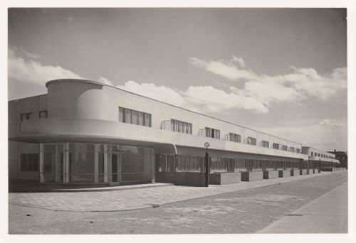 View of the principal façade of industrial row houses from across the street, Hoek van Holland, Netherlands