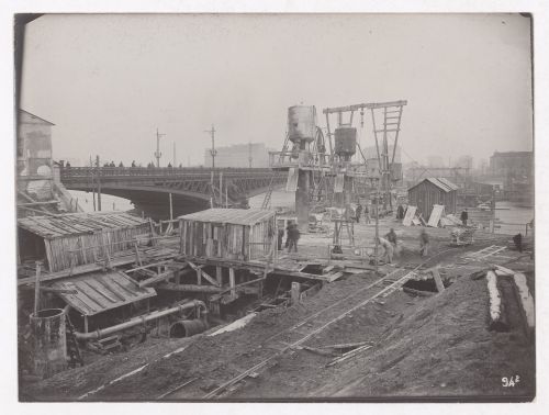 Construction of the Paris Metro, exterior view of a worksite with workers, Paris, France