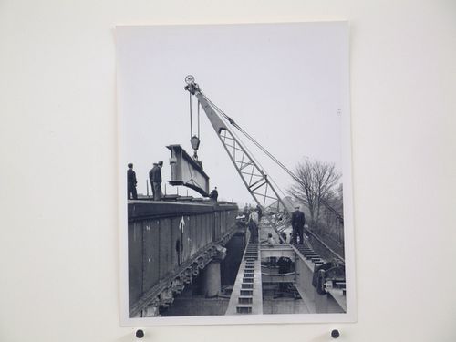 View of outer girder being picked up by crane from rail wagon, Bushey Bridge, England