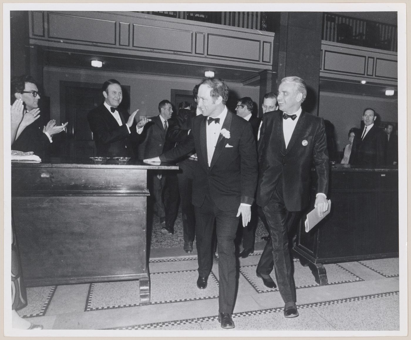 Parkin and Prime Minister Pierre Elliot Trudeau walking together at dinner event