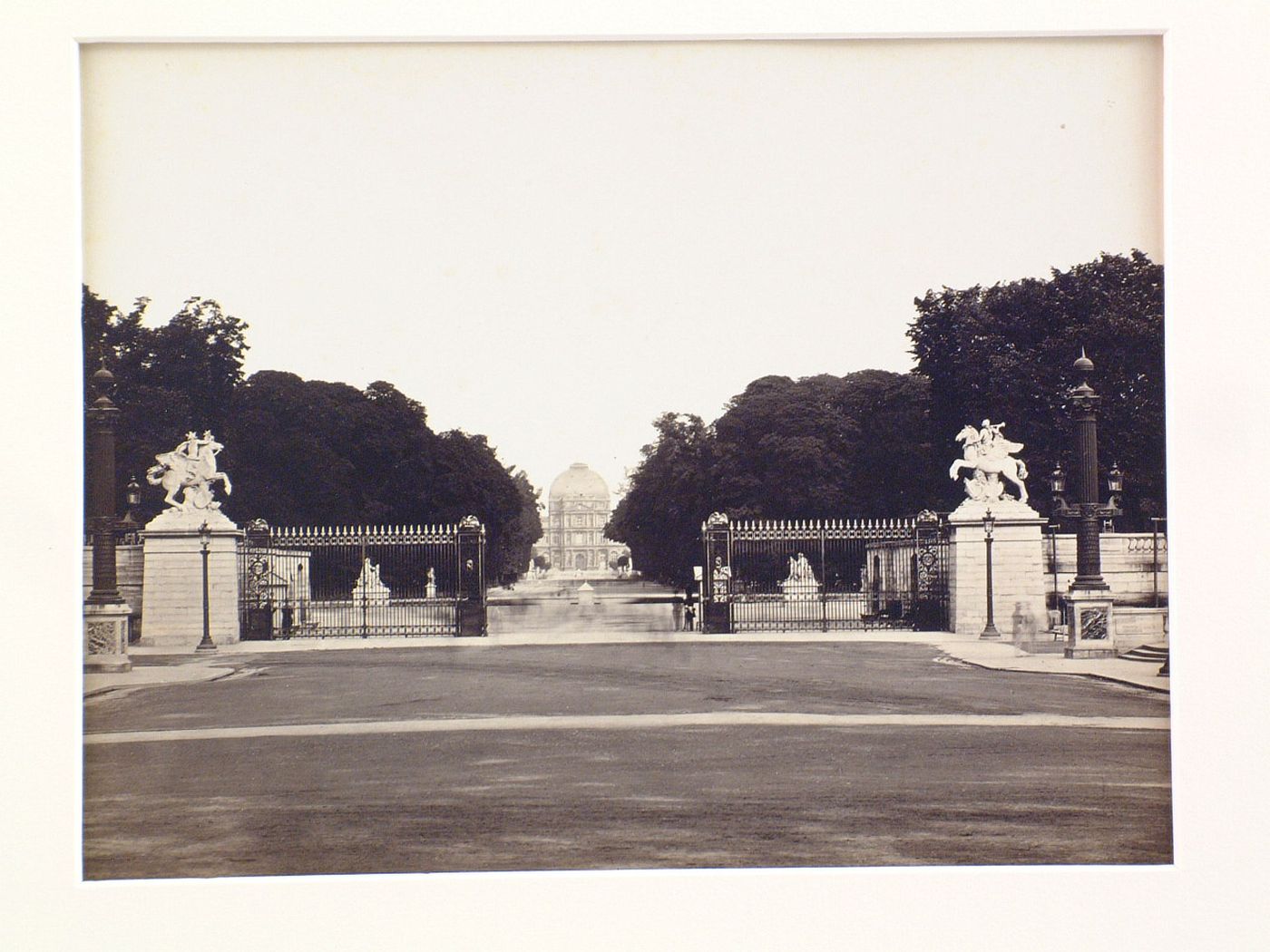 Distant view of Tuileries Palace at the end of a long vista in the gardens, Paris, France
