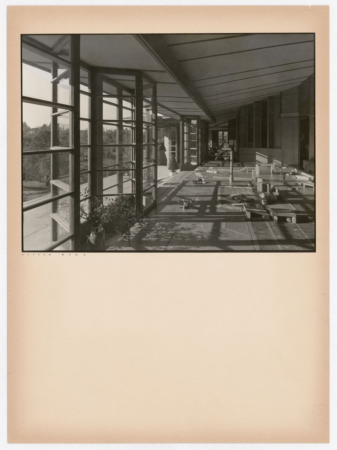 Interior view of the Hanna House showing windows, a doorway, toys, building blocks, and a wagon, Palo Alto, California, United States