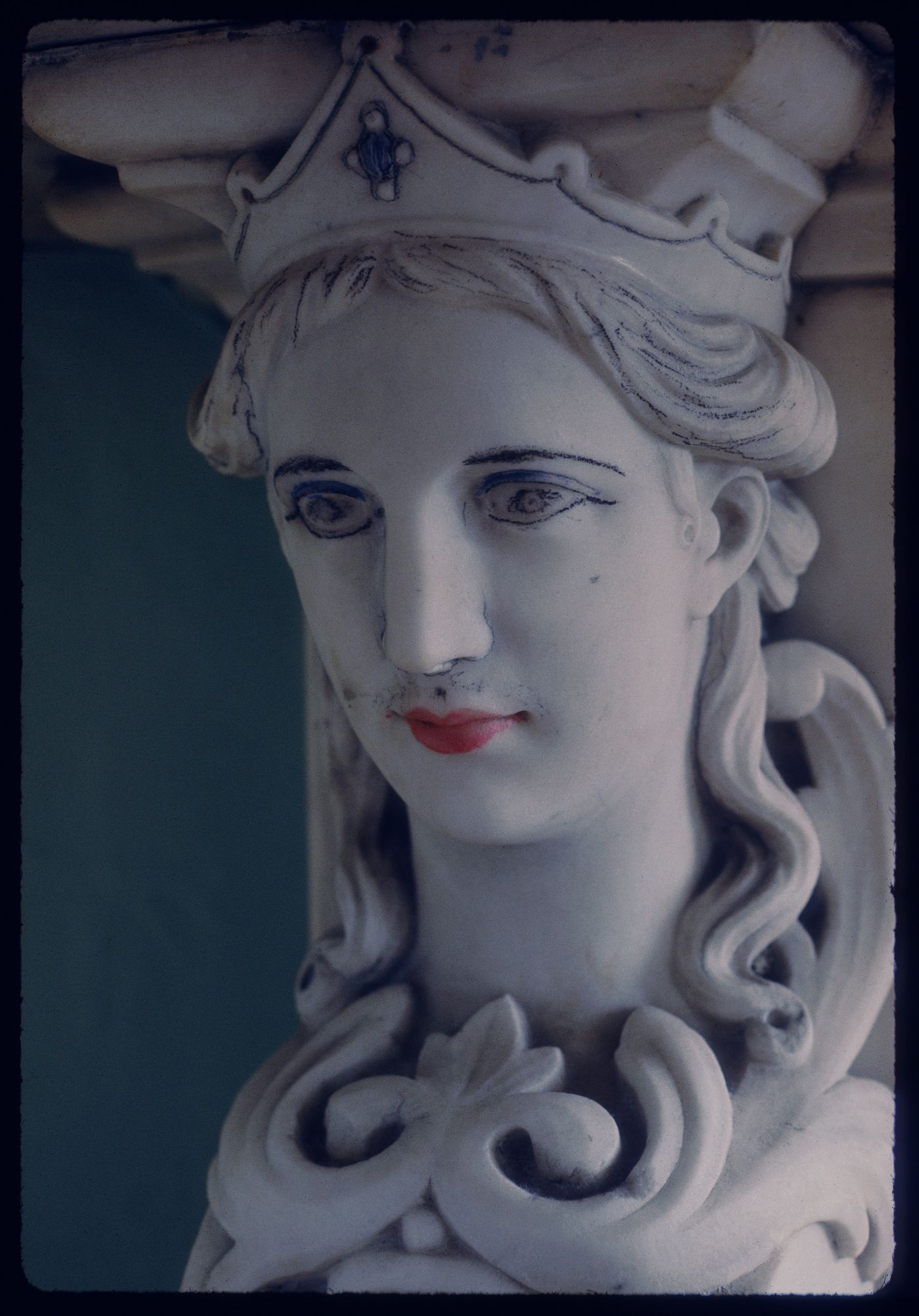 Close-up view of a carved head of a woman on the fireplace mantel of a reception room, Shaughnessy House, Montréal, Québec