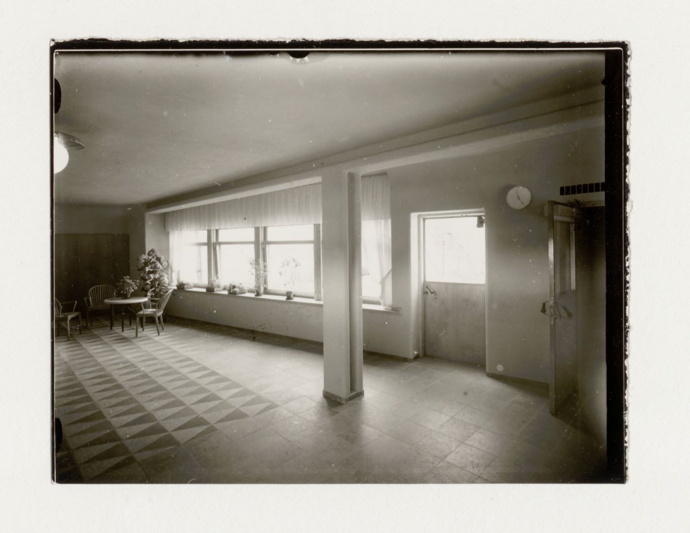 Interior view of the waiting room of the Chapel of Hope showing ceramic floor tiles [?] and windows, Woodland Crematorium and Cemetery, Stockholm