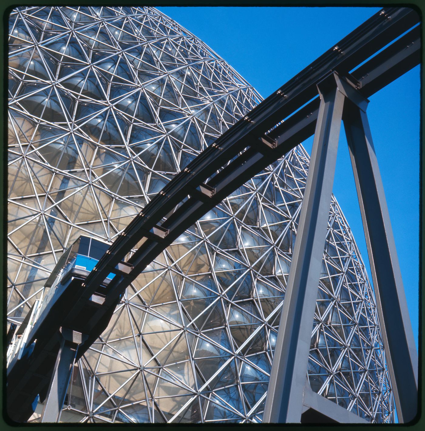 Partial view of the Pavilion of the United States with the minirail in foreground, Expo 67, Montréal, Québec