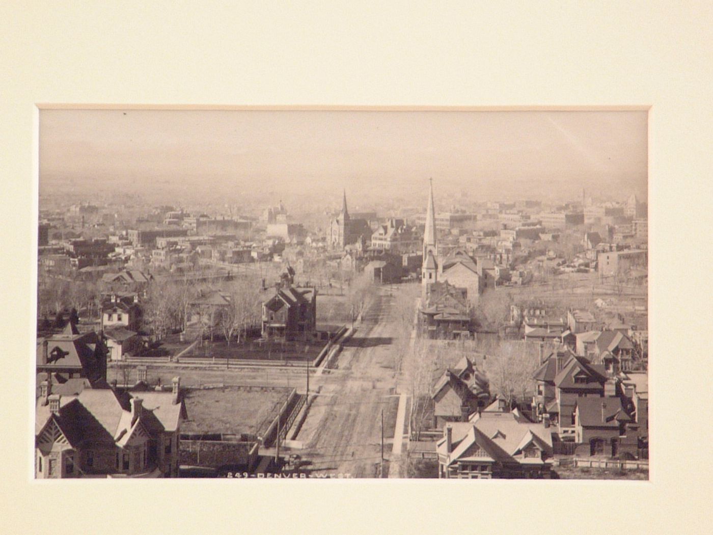 View of Denver looking up 18th [?] street and probably showing a rear view of Trinity Methodist Episcopal Church (now Trinity United Methodist Church), Colorado, United States