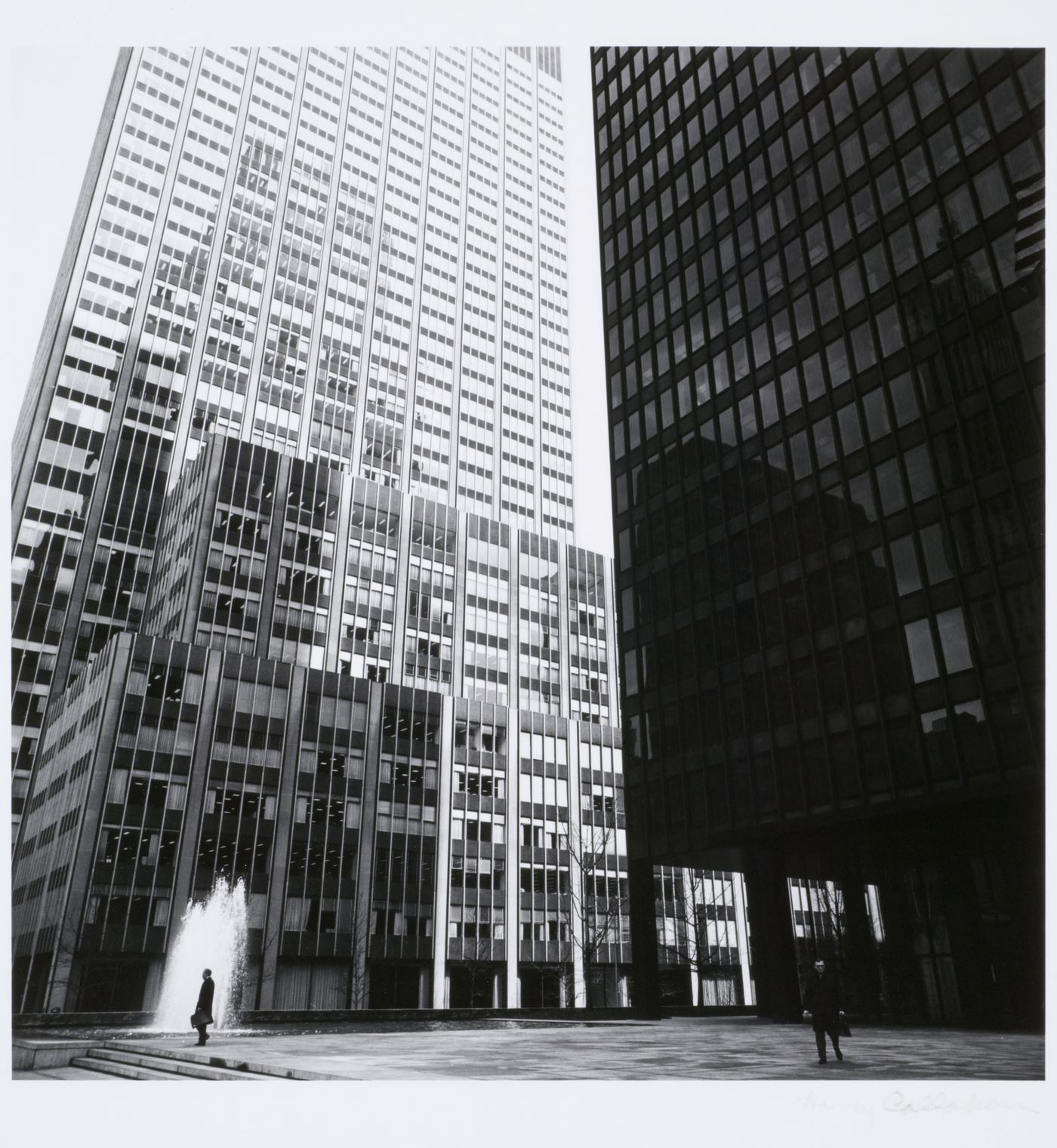 Partial view of the principal façade and plaza of the Seagram Building showing the pool and the adjacent building, New York City