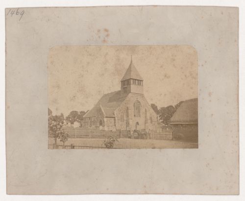 View of the west façade of the Church of All Saints taken from across a road, Whiteparish, Wiltshire, England